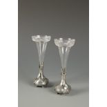 WMF: A PAIR OF ART NOUVEAU SPILL VASES with glass bodies and pewter bases, 7" high