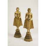 A PAIR OF FLOOR STANDING SOUTH EAST ASIAN GILT-BRONZE BUDDHIST FIGURES