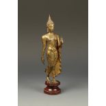 A THAI GILT-BRONZE STANDING BUDDHA