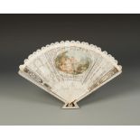 AN IVORY BRISEE TYPE FAN decorated with a central oval panel