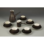 DAME LUCIE RIE (1902-1995) A coffee set with overall brown glazed ground