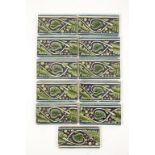 A SET OF ELEVEN WILLIAM DE MORGAN LATE FULHAM PERIOD BORDER TILES