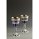 A PAIR OF BOHEMIAN BLUE, CLEAR AND WHITE OVERLAID GOBLETS