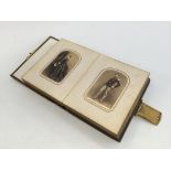 A VICTORIAN PHOTOGRAPH ALBUM, containing period photographs, including men in uniform.