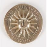 A VICTORIAN SILVER SUN FIRE OFFICE MESSENGER'S BADGE, circular with a central sun motif within