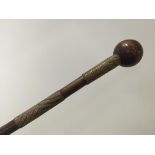 AN AFRICAN WOOD KNOBKERRY with wire metal grips, 19th century, 26" .