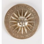 A GEORGE III SILVER SUN FIRE OFFICE MESSENGER'S BADGE, circular with a central sun motif within