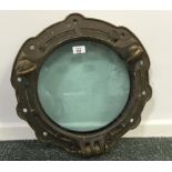 A BRASS SHIPS PORTHOLE FROM HMS WARSPITE, impressed marks, 18.5" dia.