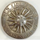 A GEORGE III SILVER SUN FIRE OFFICE MESSENGER'S BADGE, circular with a central sun motif within