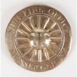 A GEORGE III SILVER SUN FIRE OFFICE MESSENGER'S BADGE, circular with a central sun motif within