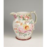 A MASSIVE CREAMWARE JUG, the bulbous body painted with naturalistic summer flowers including roses