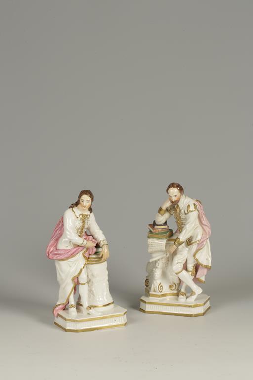 A DERBY POTTERY MODEL OF SHAKESPEARE standing by a column and resting on a pile of books, stamped to