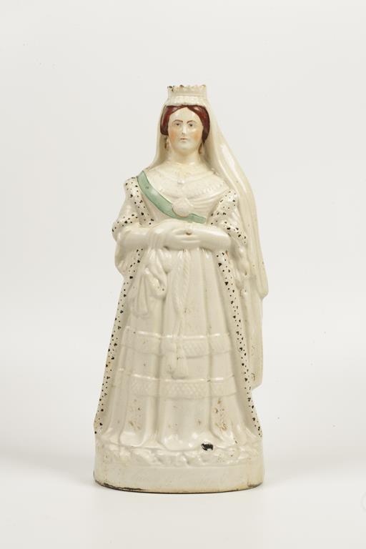 A STAFFORDSHIRE POTTERY 'FLATBACK' FIGURE of Queen Victoria standing with arms folded, 17.5" high