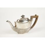 A TEAPOT of oval form with part fluted decoration and angular handle, by Joseph Rogers, Sheffield,
