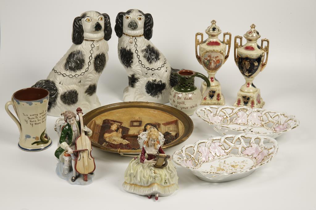 A PAIR OF STAFFORD SHIRE 'FLATBACK' SPANIEL ORNAMENTS, the dogs with black sponged decoration, 12"