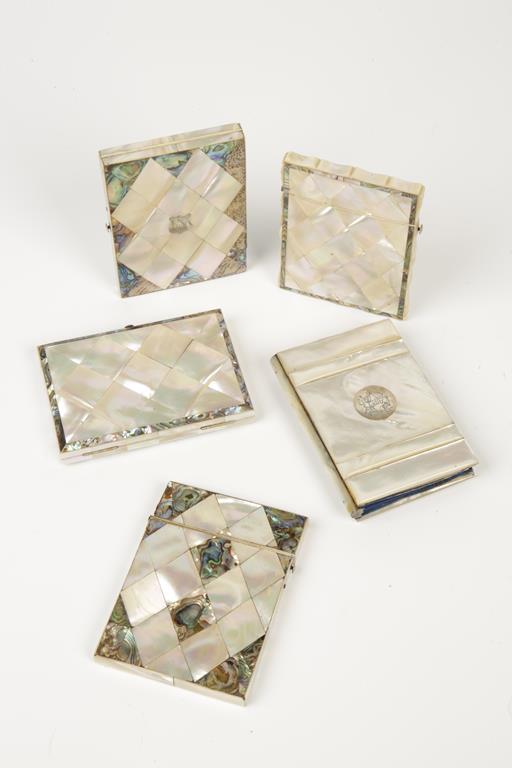 A VICTORIAN MOTHER OF PEARL CARD CASE, modelled as a book with white metal circular cartouche to the