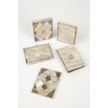 A VICTORIAN MOTHER OF PEARL CARD CASE, modelled as a book with white metal circular cartouche to the