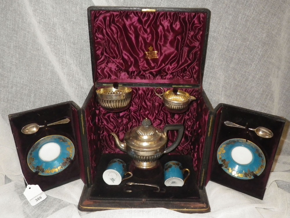 A PRESENTATION THREE PIECE SILVER TEASET in leather presentation case with accompanying cups,