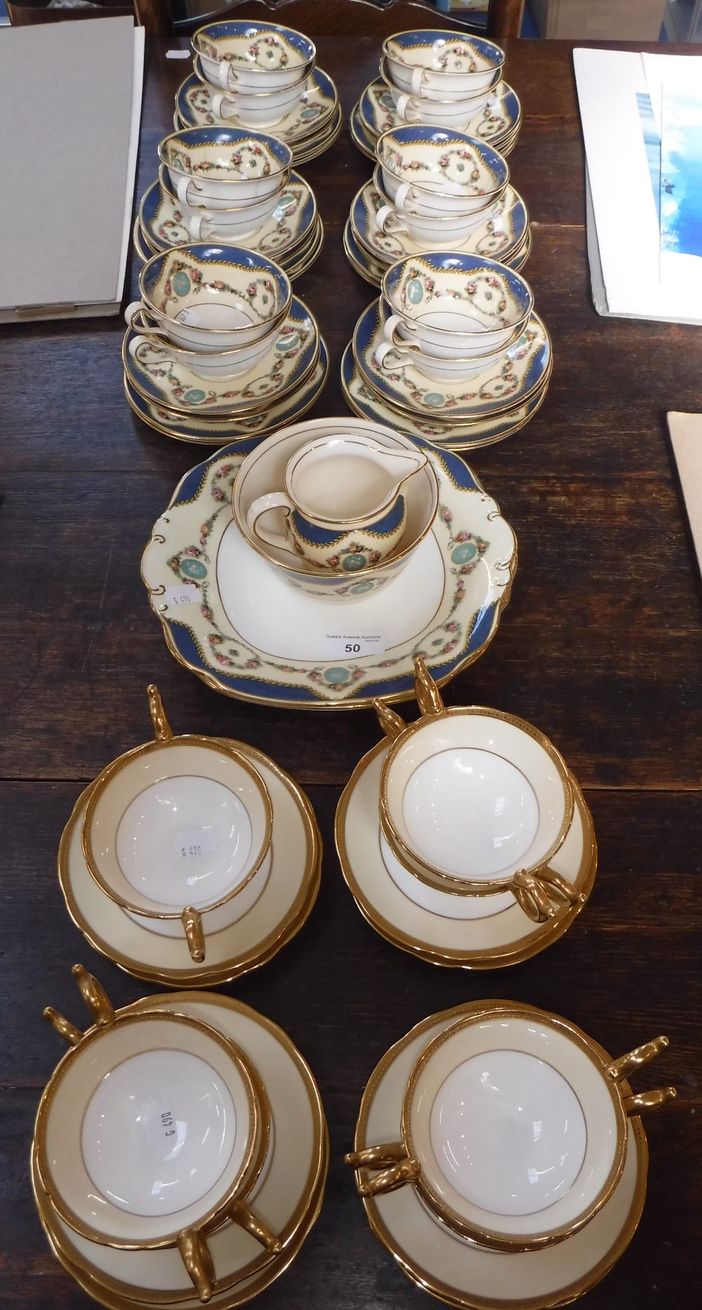 A CAULDON CHINA TEA SET in cream and blue, with floral swag decoration and a quantity of Coalport