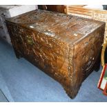 AN ORIENTAL CAMPHOR WOOD CHEST, with all over relief carved decoration