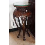 A CHINESE HARDWOOD OCCASIONAL TABLE with a circular top above a carved frieze and shaped legs