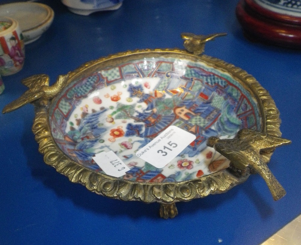 A CHINESE SAUCER in gilt metal mounts