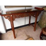 A CHINESE HARDWOOD ALTAR TYPE SIDE TABLE with pierced frieze