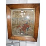 A VICTORIAN NEEDLEWORK OF A GIRL ON HORSEBACK, in its original frame