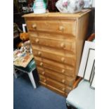 A MODERN PINE SIX DRAWER CHEST OF DRAWERS on plinth base