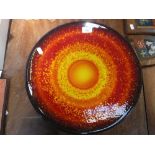 A LARGE POOLE POTTERY CHARGER 'SUN' 15.75" diameter