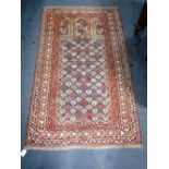 A PERSIAN DESIGN PRAYER RUG with geometric decoration 39" x 64" (plus fringes)