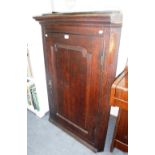 A GEORGE III OAK HANGING CORNER CUPBOARD with panel door and green painted shaped shelves