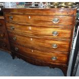 A REGENCY MAHOGANY BOWFRONTED CHEST OF DRAWERS with caddy moulded and crossbanded top above four