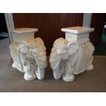 A PAIR OF ORIENTAL CREAM CERAMIC GLAZED GARDEN SEATS in the form of elephants