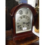 AN EDWARDIAN MAHOGANY CASED BRACKET CLOCK with silvered dial and chiming movement (pendulum in