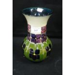 A MOORCROFT POTTERY VASE, decorated with 'Glasgow' style flowers with incised and painted marks
