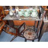 AN EDWARDIAN CARVED OAK OCCASIONAL TABLE, a similar spinning chair and a folding Moorish style stand