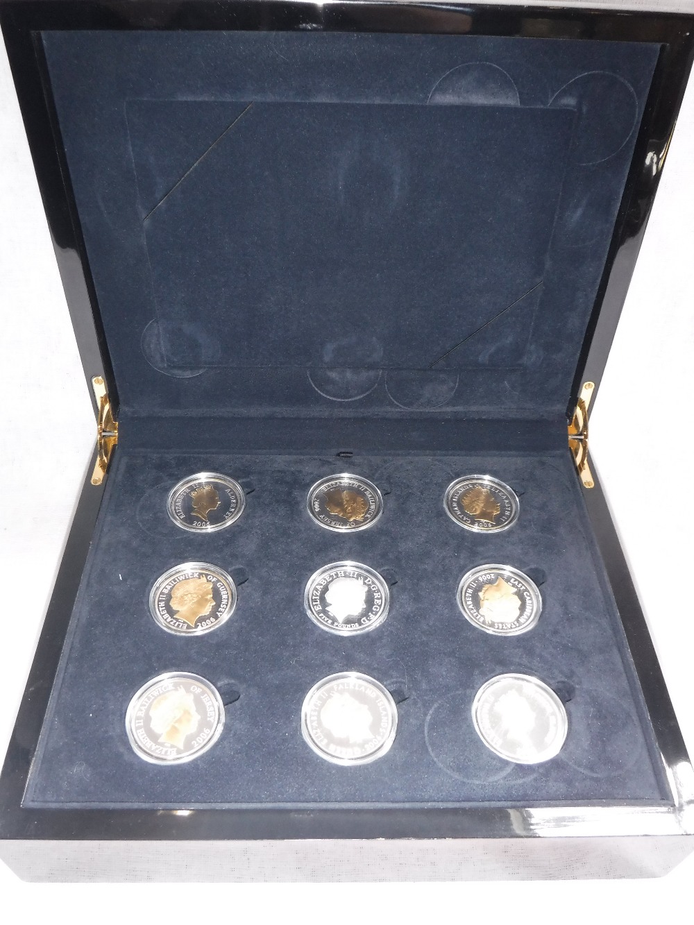 A CASED SET OF THE QUEEN'S 80TH BIRTHDAY SILVER PROOF COIN COLLECTION, eighteen coins