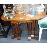 A NEST OF THREE LIGHT OAK TABLES