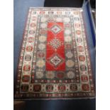 A PERSIAN DESIGN RUG, in red, blue and green, 41" X 60"