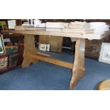 A REFECTORY TYPE DINING TABLE, with rectangular top on trestle base