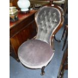 A VICTORIAN WALNUT LADIES CHAIR upholstered and buttoned in plum velvet