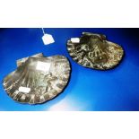 A PAIR OF CAST METAL SCALLOP SHELL-SHAPE DISHES decorated with putti, signed 'J Garnier'