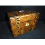 A VICTORIAN WALNUT AND PARQUETRY TEA CADDY