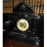 A VICTORIAN BLACK SLATE MANTEL CLOCK of architectural form (key and pendulum in office)