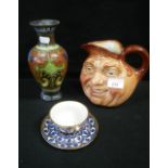 A ROYAL DOULTON JOHN BARLEYCORN JUG, a gouda vase and a decorative cup and saucer