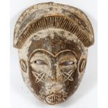 AFRICAN, CARVED WOOD MASK, H 12", W 8"With pursed lips.- For High Resolution Photos visit