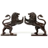 PATINATED METAL LION BOOKENDS, PAIR H 8", W 7 3/4"Depicts two rearing lions with extended front