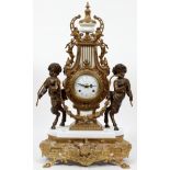 IMPERIAL FRENCH STYLE GILT METAL MANTLE CLOCK H 24"Harp form case flanked by satyrs. Dial is