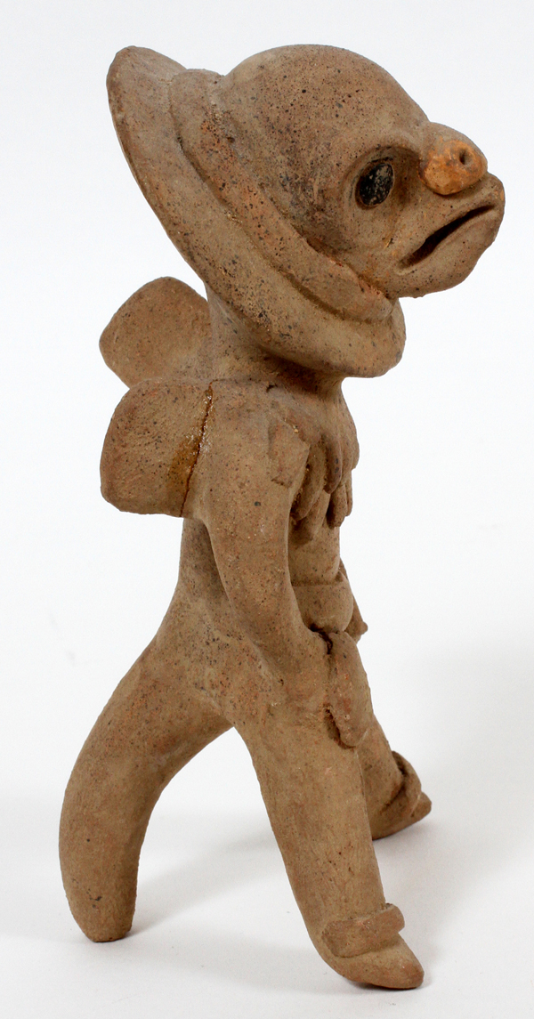 PRE-COLUMBIAN, TERRACOTTA FIGURE, H 6"A male figure with a bird face.There is a repair on arm.- - Image 2 of 2